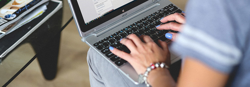 woman typing on keyboard