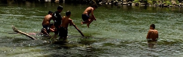 kids swimming in river