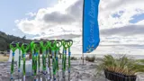 Spades in the sand at Waihi Beach