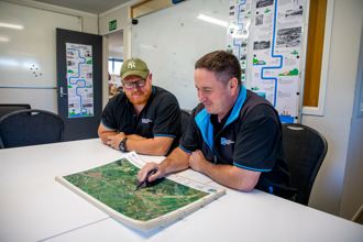 Two men looking at a map